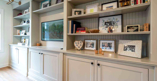 A stylish home in Milwaukee Metro featuring shelves & frames on the wall showcasing a modern remodel