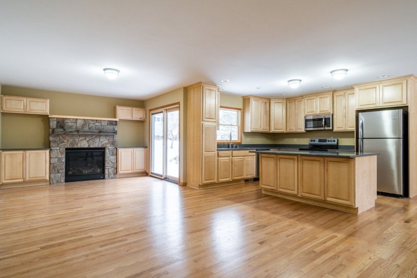 A Kitchen with hardwood flooring showcasing a whole-home remodel in the Milwaukee Metro Area